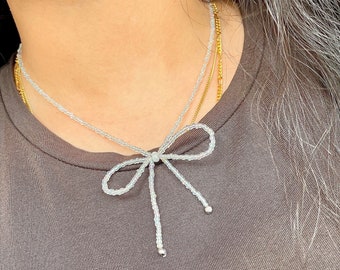 BOW | Dainty beaded bow necklace, bow jewellery, coquette necklace, coquette jewellery, white bow, clear bow necklace, invisible string