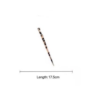 May include: A black and white patterned hair pin with a rounded end. The pin is 17.5 inches long.