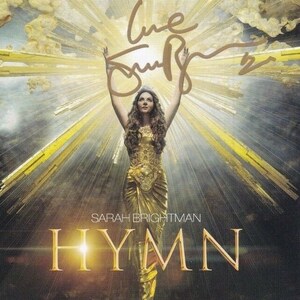May include: A woman in a gold dress with her arms raised, standing in front of a bright light. The text "HYMN" is written in large letters below her, and the text "SARAH BRIGHTMAN" is written in smaller letters above the word "HYMN".
