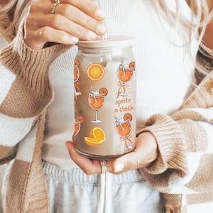 aperol spritz iced coffee glass,coquette aperol spritz party,signature drink,citrus bridal shower,bachelorette merch,prosecco gift,straw