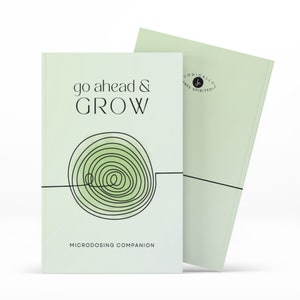 May include: A green and white book with the title "go ahead & GROW" and the subtitle "MICRODOSING COMPANION". The book has a black and white illustration of a spiral on the front cover.