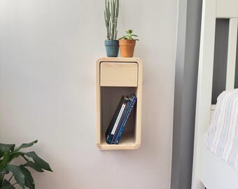 Mesita de noche flotante de madera natural hecha a mano, ideal para dormitorios pequeños.