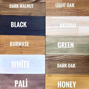 Puede incluir: Una paleta de colores que muestra varias opciones de tinte para madera. La imagen muestra bloques rectangulares de madera, cada uno te&ntilde;ido en un color diferente, incluyendo Nogal Oscuro, Negro, Blanco y Miel, con los nombres de los colores en texto blanco.