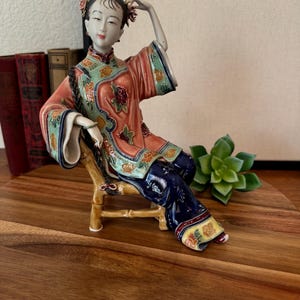 Beautiful Ceramic Chinese Woman Figurine Sitting on Bamboo Chair