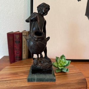 Heavy Bronze Sculpture of Boy with a Basket on Tiered Green Marble Base