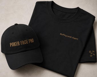 May include: A black baseball cap with the text POKER FACE PRO embroidered in gold, paired with a black t-shirt featuring the gold embroidered text Bluffing Level: Expert on the chest and a small gold embroidered pattern on the sleeve.