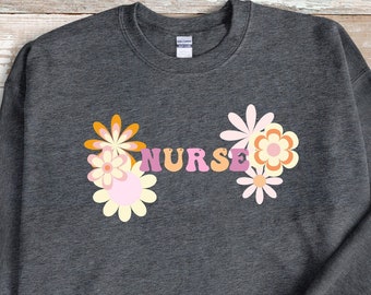 Retro verpleegstersweater: boho bloemen ronde hals