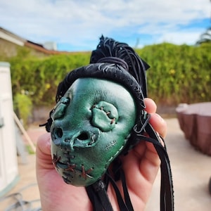 Shrunken head (coin purse)