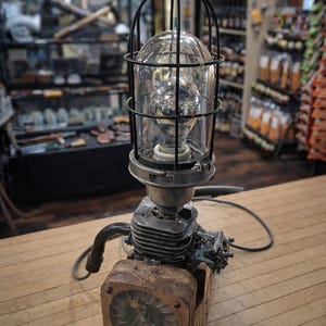 Repurposed Engine Block Table Lamp with Caged Glass Globe