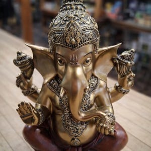 Ganesh Statue – Multi-Arm Resin Figurine