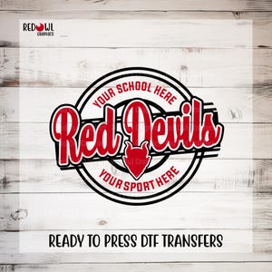 May include: A red and black graphic design featuring the words "Red Devils" in a stylized font, with a devil head icon. The design includes the text "Your School Here" and "Your Sport Here" in a circular border. The text "READY TO PRESS DTF TRANSFERS" is at the bottom.