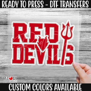 May include: Red Devils iron-on transfer design with a red devil's tail and a red heart.  Custom colors available.
