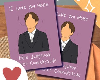 May include: Two purple cards with a cartoon illustration of a person in a suit. The text on the cards reads "I Love You More than Jung Kook Loves Countryside" and "Like You More than Jung Kook Likes Countryside".