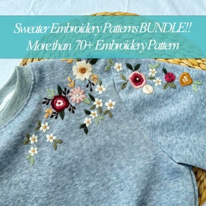May include: A light blue sweatshirt with embroidered floral patterns in shades of pink, red, yellow, and white. The text "Sweater Embroidery Patterns BUNDLE!! More than 70+ Embroidery Pattern" is displayed above the sweatshirt.