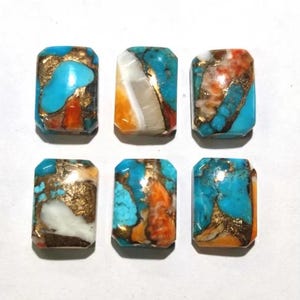 May include: Six rectangular turquoise cabochons with gold and orange accents. The stones are cut in a rectangular shape and have a smooth, polished finish.