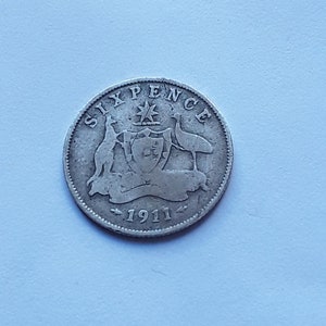 A 1911 Australia silver sixpence coin.