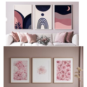 May include: Three framed prints of abstract art with pink, blue, and white colors. The prints are hanging on a light pink wall above a white couch with pink pillows.