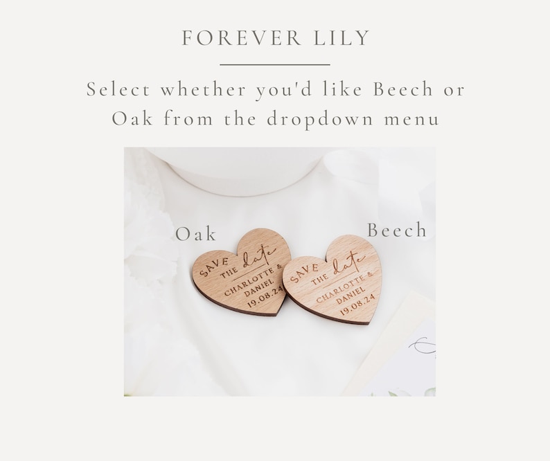 May include: Two heart-shaped wooden save-the-date announcements. The text "SAVE THE DATE" is engraved, along with the names "CHARLOTTE & DANIEL" and the date "19.08.24". The text "FOREVER LILY" is at the top.