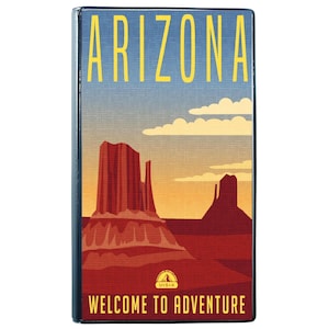 May include: A rectangular magnet featuring a desert landscape with red rock formations under a blue and orange sky. The word ARIZONA is printed in yellow at the top, and the text WELCOME TO ADVENTURE is printed in yellow at the bottom.