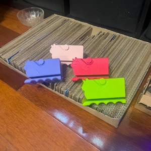 Strumento per tagliare il cartone a forma di gatto