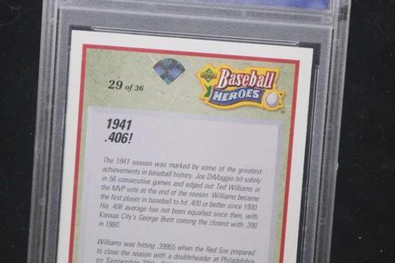 May include: A baseball card from the "Baseball Heroes" series, encased in a protective holder. The card features text including "1941 .406!" and details about the 1941 baseball season. The card is labeled "29 of 36".