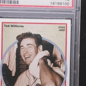 May include: A baseball card featuring Ted Williams, with the text "Ted Williams" and "1941 .406!". The card is encased in a clear protective holder. The card has a red border and a sepia-toned image of Williams.
