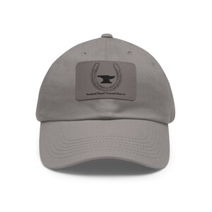 May include: A gray baseball cap with a patch featuring a horseshoe and anvil with the text "Sound Hoof Sound Horse".