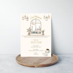 May include: An invitation card with the words "Eid Mubarak" at the top. The card features a watercolor illustration of a mosque, a crescent moon, and hanging lanterns. The text invites guests to celebrate Eid al-Fitr, hosted by Ismail & Family.