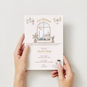 May include: An invitation card with the words "Eid Mubarak" at the top. The card features a watercolor illustration of a mosque, a crescent moon, and hanging lanterns. The text invites guests to celebrate Eid al-Fitr.