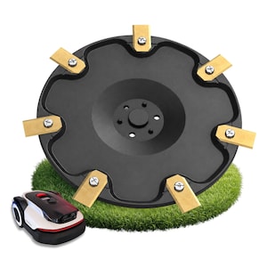 May include: A black circular mower blade disc featuring six rectangular gold-coloured metal blades attached with silver screws, positioned above a small white and black robotic lawn mower resting on a patch of green grass.