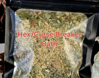 May include: A black, resealable bag filled with dried herbs and botanicals. The bag has the words "Hex/Curse Breaker Bath" printed in red. The contents appear to be a mix of green, brown, and tan plant matter. The bag is sealed and ready for use.