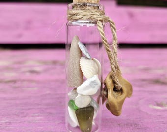 Bottled beach treasures, contains Norfolk Seaglass, hagstone, shells, & fossils