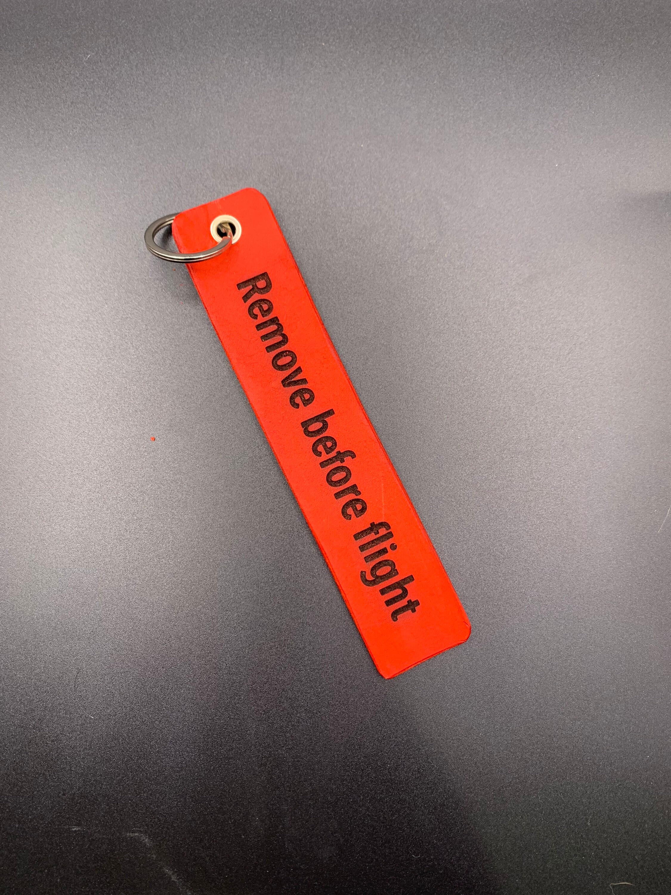 Remove before flight shop jacket tag
