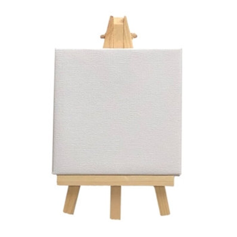 May include: A small wooden easel with a blank canvas attached. The easel is made of natural wood and has a simple design.