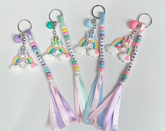 Colourful Handmade Personalised Keyring with a Cute Large Unicorn Sitting on Rainbow with Heart Charm