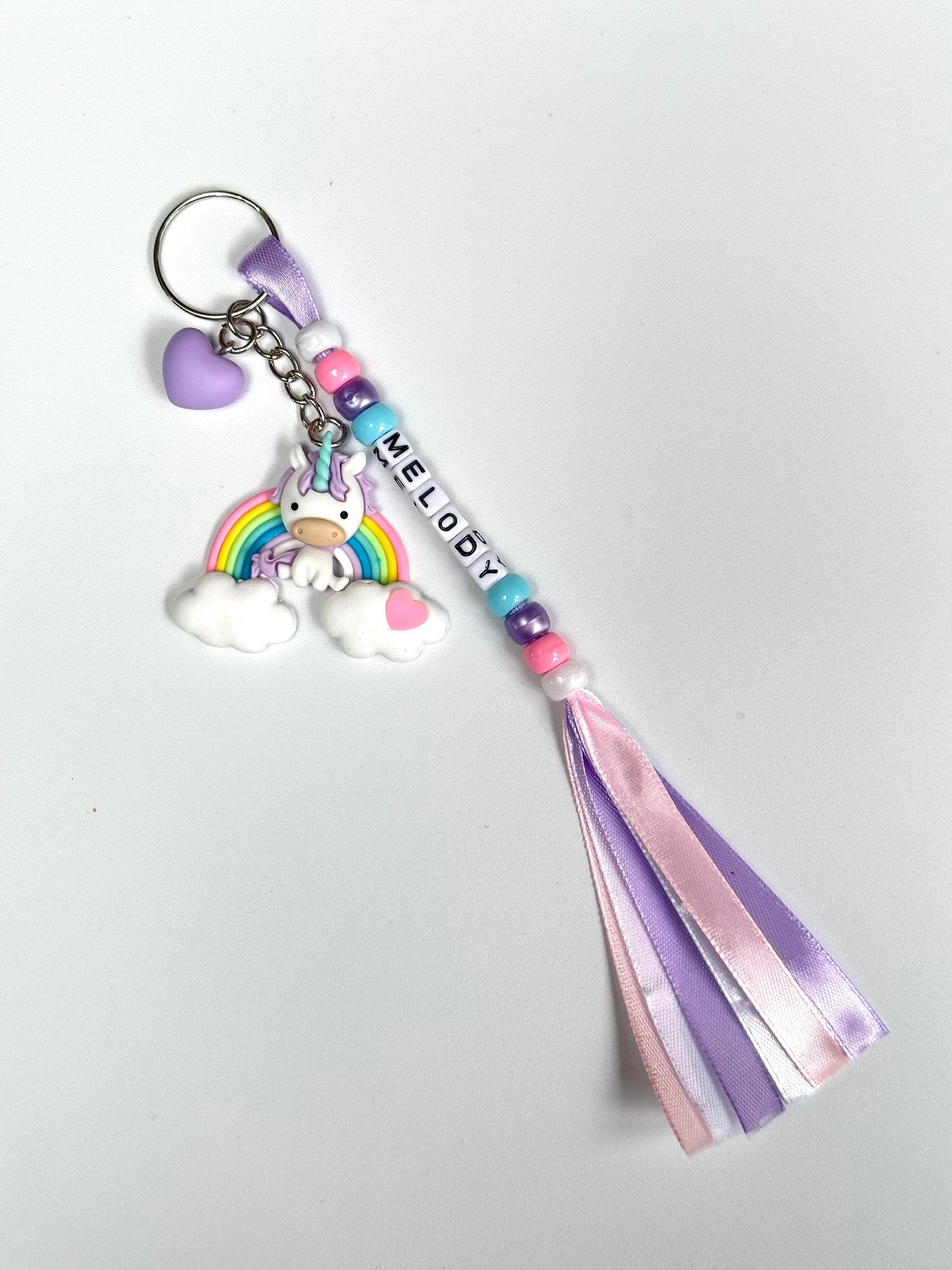 Colourful Handmade Personalised Keyring with a Cute Large Pony Sitting on a Rainbow with Heart Charm
