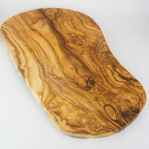 Large and rustic cutting board made of olive wood with a length of 55-60 cm