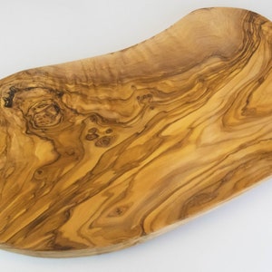 Large and rustic cutting board made of olive wood with a length of 50-55 cm