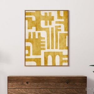 May include: Abstract geometric art print with a mustard yellow and white color scheme. The print features a series of overlapping shapes and lines, creating a modern and minimalist design.