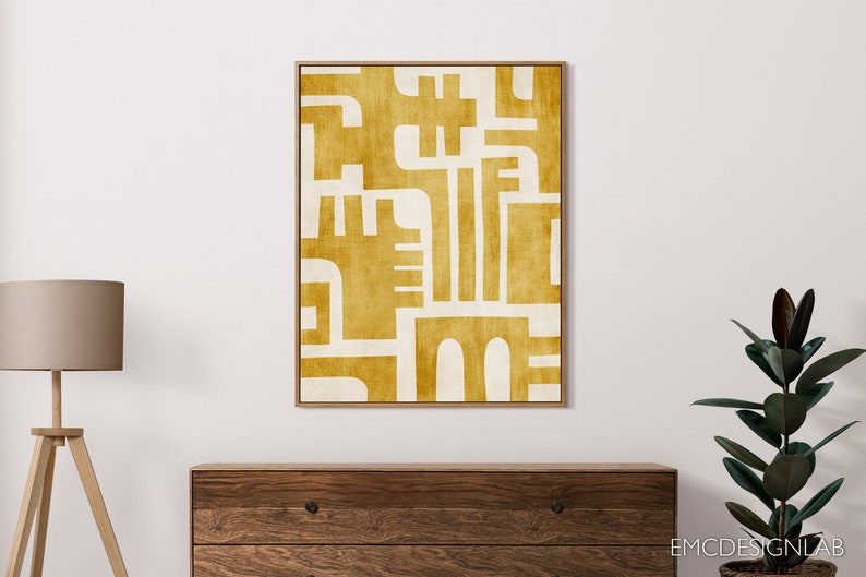 May include: Abstract geometric art print with a mustard yellow and white color scheme. The print features a series of overlapping shapes and lines, creating a modern and minimalist design.