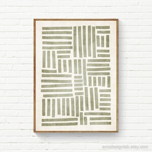 May include: A framed abstract print with a geometric pattern of overlapping green lines on a white background.