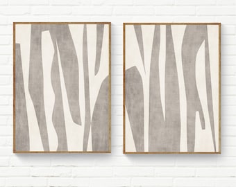 Pode incluir: Duas impressões de arte abstrata emolduradas com fundo branco e formas abstratas cinzas. As impressões são de estilo moderno e ficariam ótimas em uma sala de estar ou quarto.