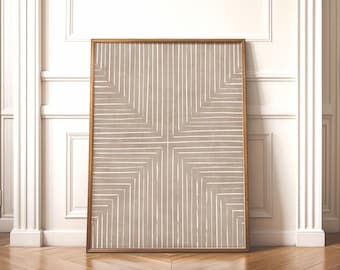 May include: A rectangular framed wall art piece featuring a taupe background with a geometric pattern of thin white vertical and horizontal lines that form a symmetrical cross shape radiating from the center toward the edges of the frame.