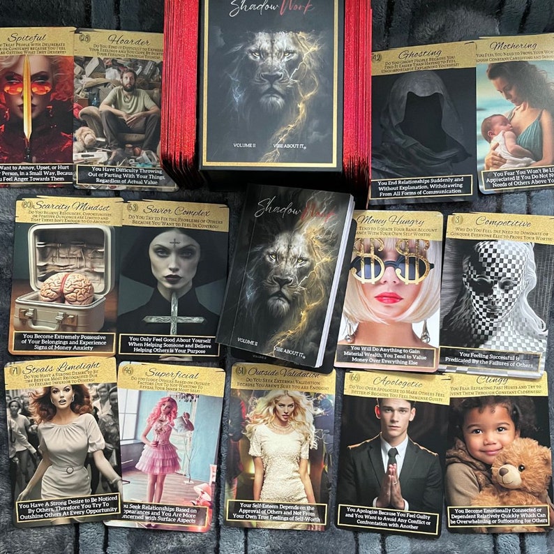 May include: A set of tarot cards with black and gold backgrounds featuring various images, including a lion, a woman with dollar sign glasses, and a person with a checkered face. The cards are titled "Shadow Work" and are divided into two volumes.