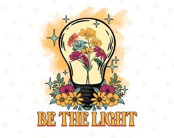 May include: A digital design featuring a lightbulb filled with colorful flowers. The phrase "BE THE LIGHT" is written in orange letters below the lightbulb. The design includes stars and floral accents, with the text "PNG DIGITAL DESIGN" at the bottom.