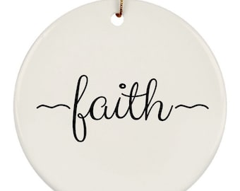 May include: White ceramic ornament with the word "faith" written in black cursive script.