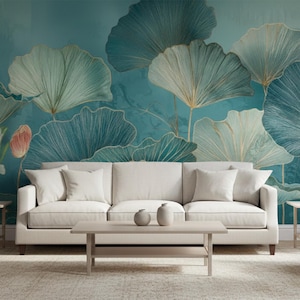 May include: A living room scene featuring a white sofa with matching throw pillows, a light wood coffee table, and two armchairs. The backdrop is a teal mural with large, stylized lotus flowers in shades of blue, green, and gold.