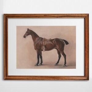 May include: A framed print of a brown horse with a saddle, standing on a light brown background.