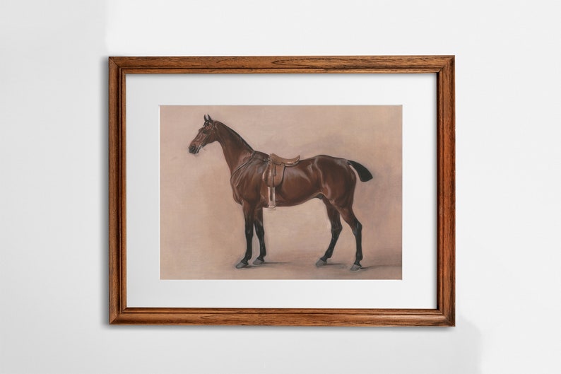 May include: A framed print of a brown horse with a saddle, standing on a light brown background.