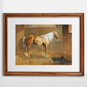 May include: A painting of a light brown horse with a white mane and tail standing in a stable. The horse is facing to the right and has its head slightly lowered. The stable is dimly lit and has a straw-covered floor.